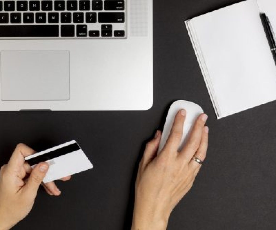 hand-using-mouse-holding-credit-card