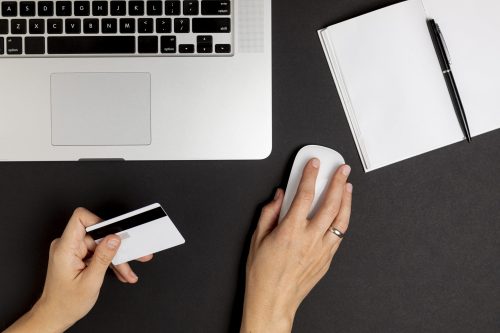 hand-using-mouse-holding-credit-card